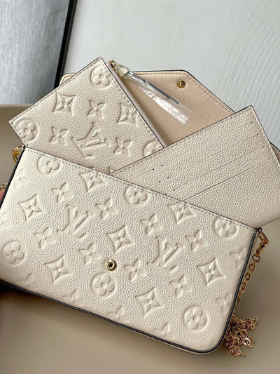 Cartera de mano con cadena Félicie Crema