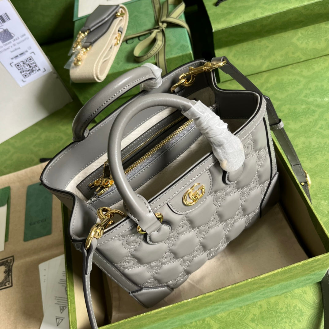 Minibolso de mano de matelassé con GG Gris