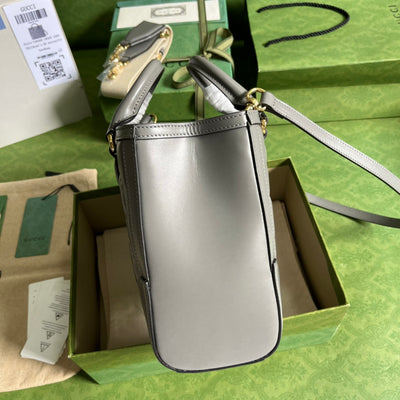 Minibolso de mano de matelassé con GG Gris