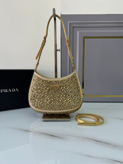 Bolso de satén Prada Cleo con cristales Dorado